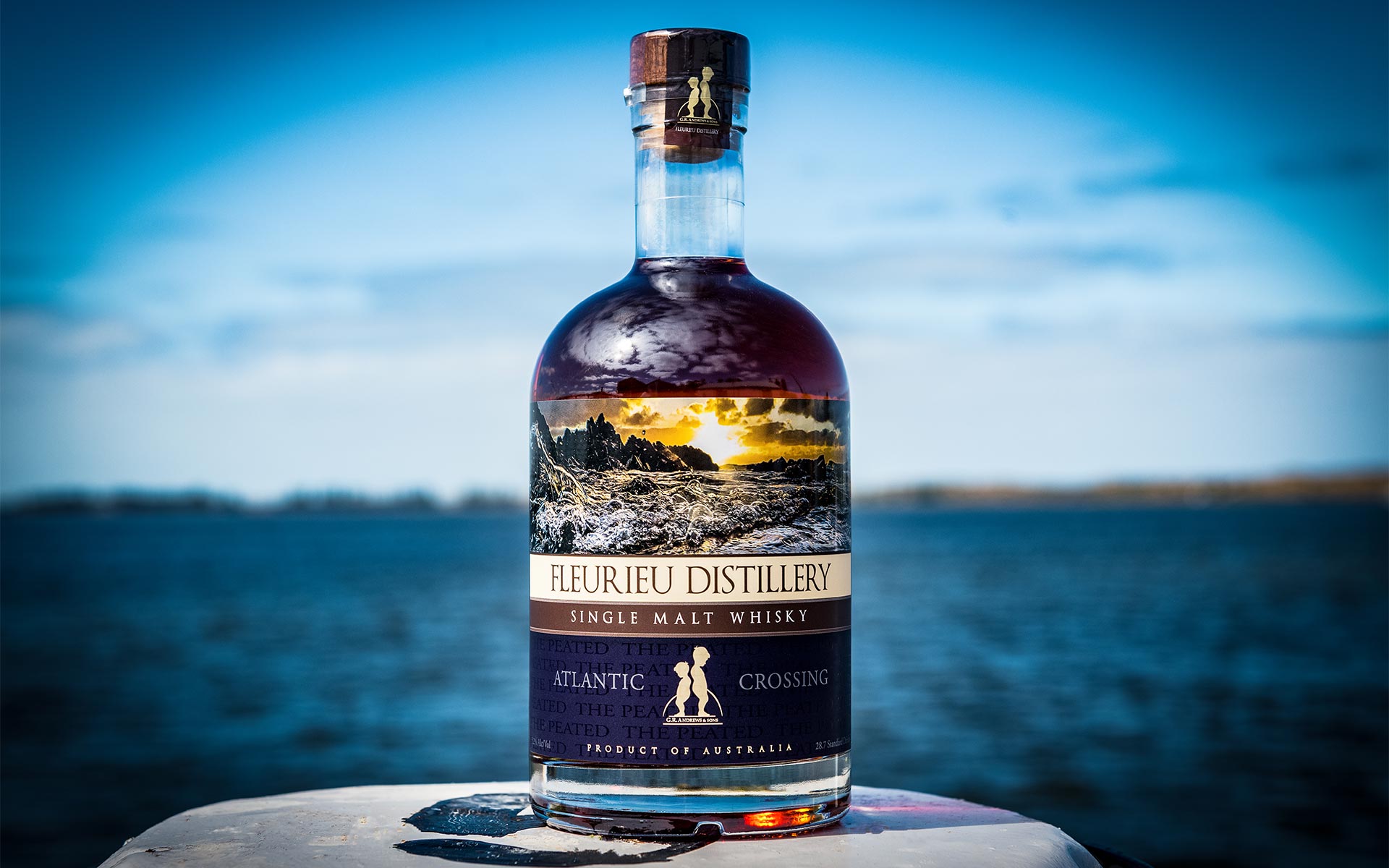 Fleurieu Distillery International Award Winners - Whisky bottle infront of the lake