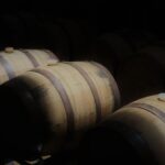 Tria Prima distillery - barrels in a dark warehouse