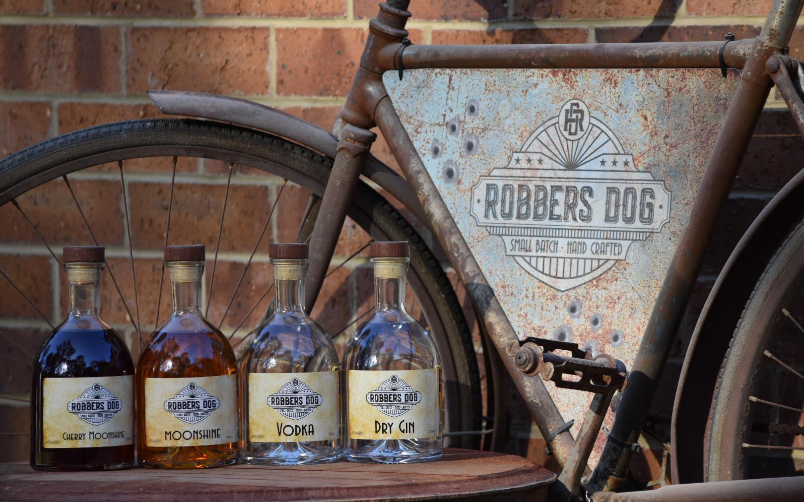 Robbers Dog Distillery - Bike sign and range of spirit bottles