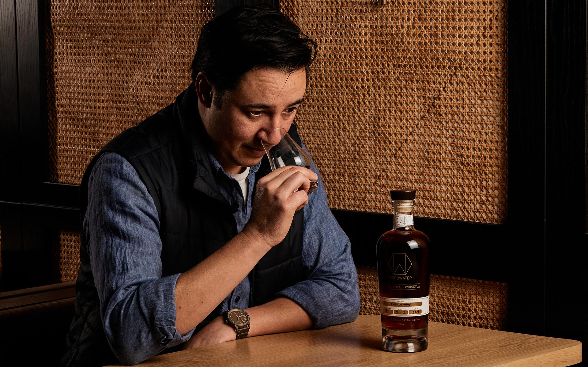 Woodwater – Distiller's Nose (male distiller enjoying the aroma of a glass of whisky)