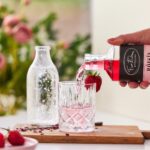 Five Eleven Distilling Rose Gin being poured into a glass