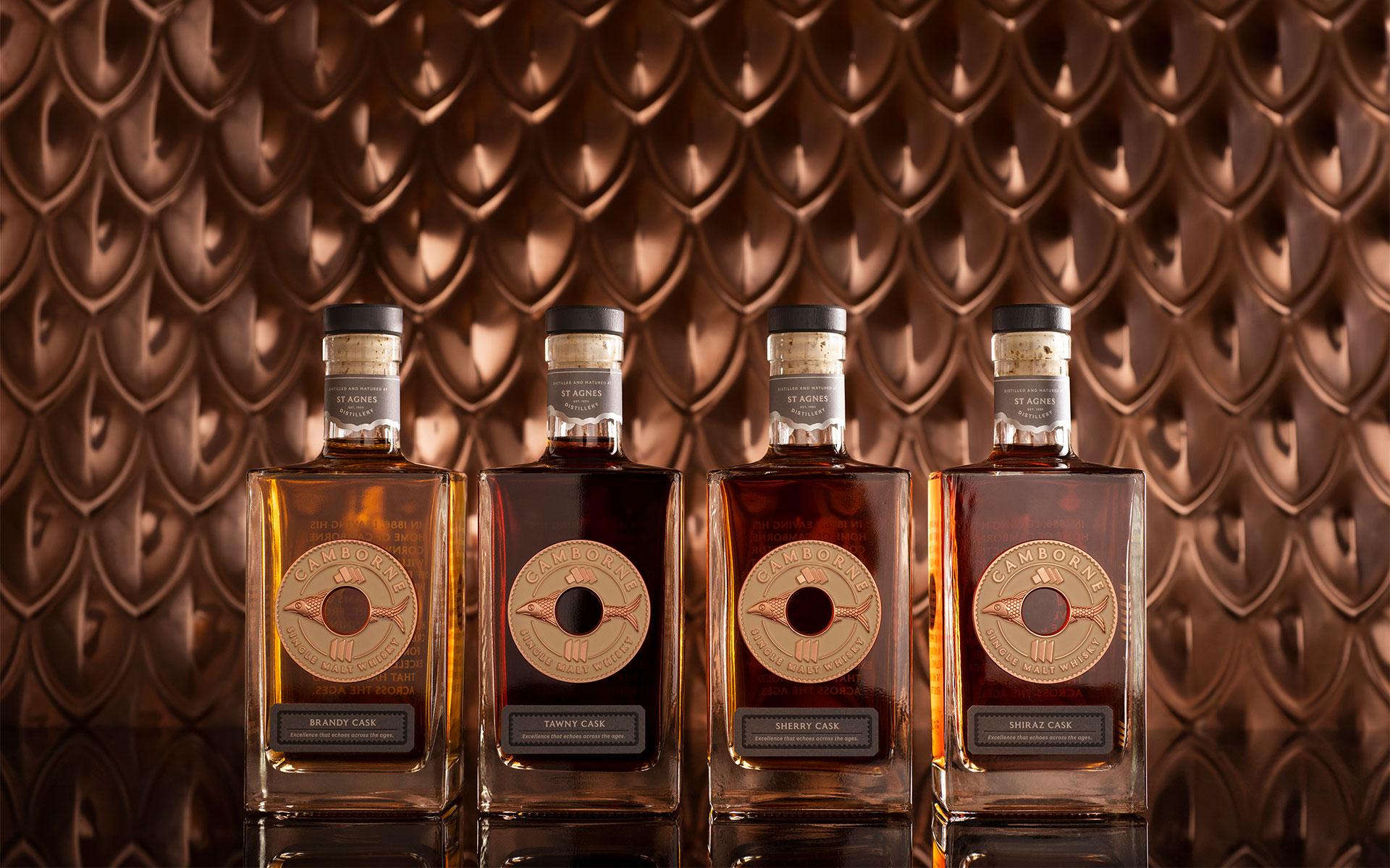 St Agnes Camborne single malt whisky range against a copper background